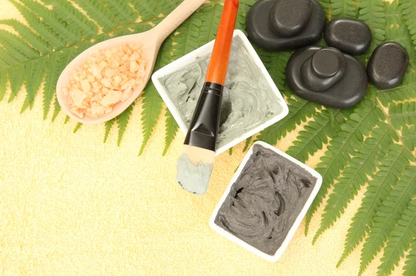 stock image Cosmetic clay for spa treatments on yellow background close-up