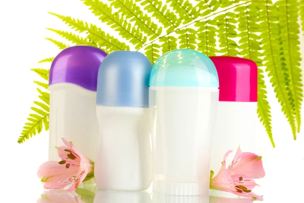 Deodorants with flowers and green leaf isolated on white — Stock Photo, Image