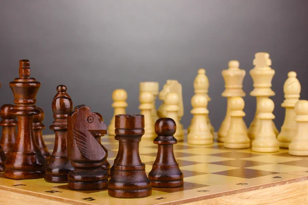 Sakk, sakk darab szürke háttér — Stock Fotó