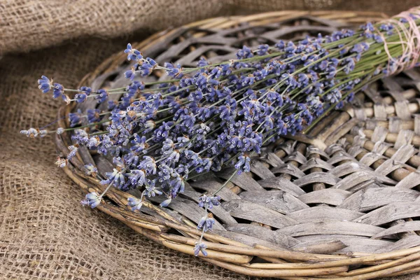 Lavender flowers on sackcloth — Stok fotoğraf