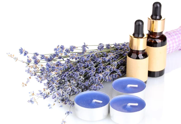 Lavendel blommor med aroma oljor och ljus isolerad på vit — Stockfoto