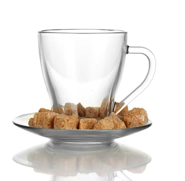 Lump brown cane sugar cubes in glass cup isolated on white Royalty Free Stock Images