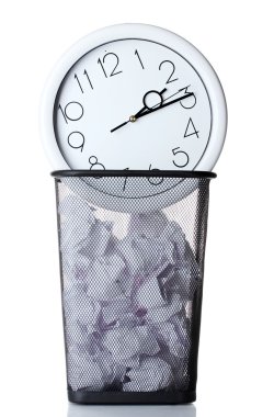 Wall Clock and paper in metal trash bin isolated on white clipart