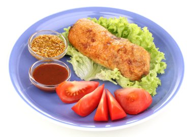 Tasty meat cutlet with garnish on plate isolated on white