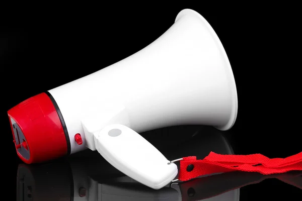 Red and white megaphone isolated on black — Stock Photo, Image