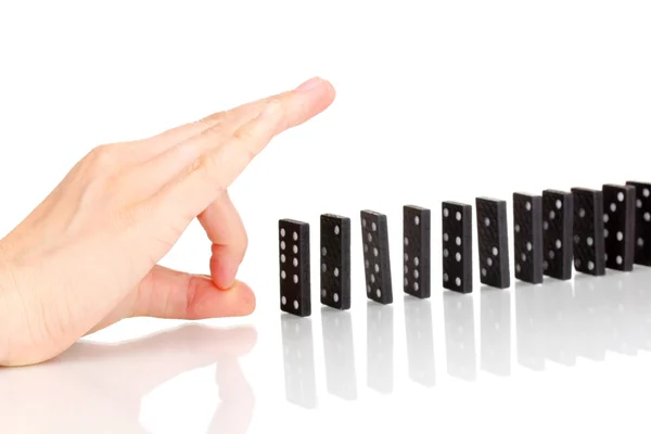 Hand trycka dominobrickor isolerad på vit — Stockfoto