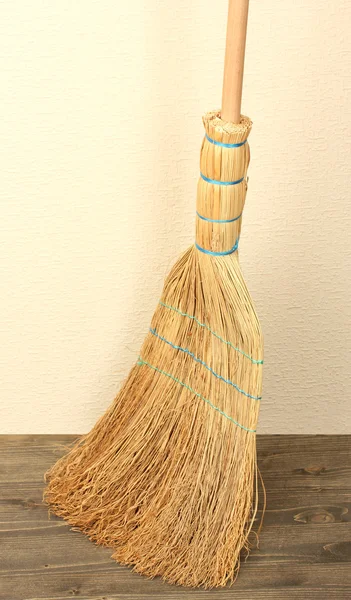 Broom on floor in room — Stock Photo, Image