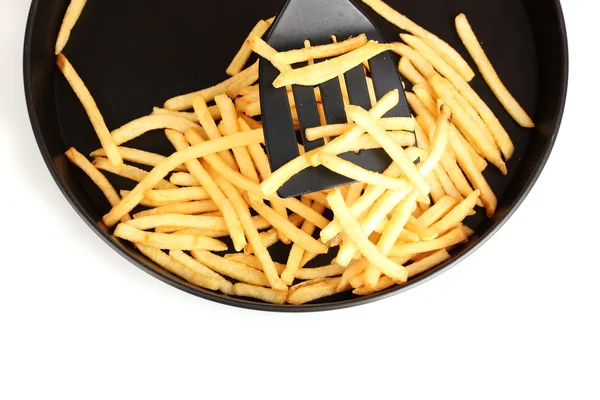 Aardappelen frietjes in de pan op witte achtergrond close-up — Stockfoto