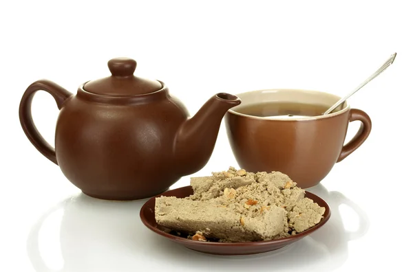 Teapot with cup and saucer with sweet halva isolated on white — Stock Photo, Image