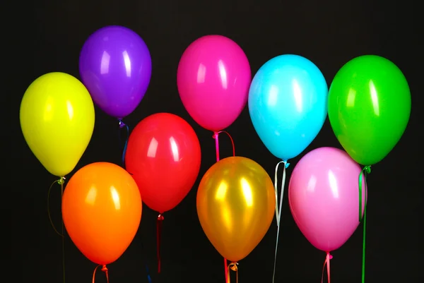 Colorful balloons isolated on black background — Stock Photo, Image