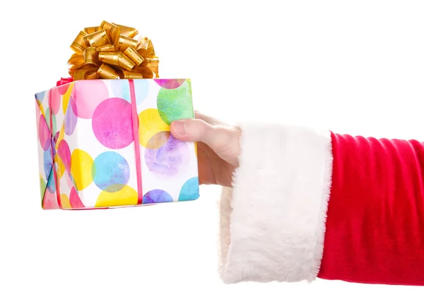 Santa Claus hand holding gift box isolated on white — Stock Photo, Image