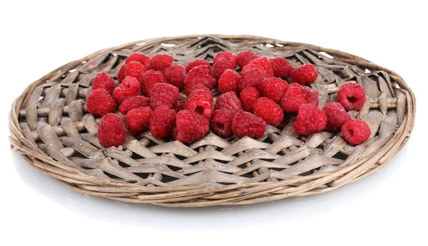 Raspberries on wicker mat isolated on white — Stock Photo, Image