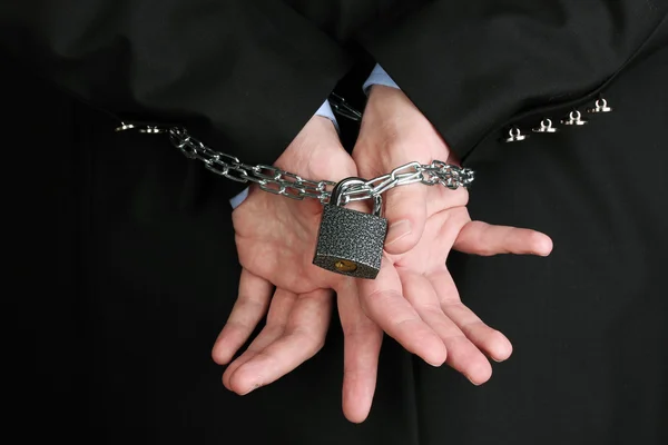 Businessman hands fettered with chain and padlock — Stock Photo, Image