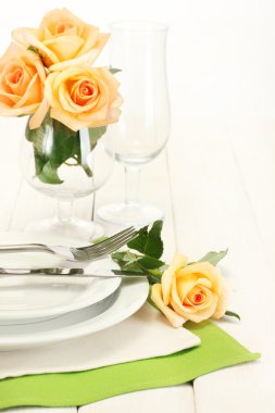 Beautiful holiday table setting with flowers clipart