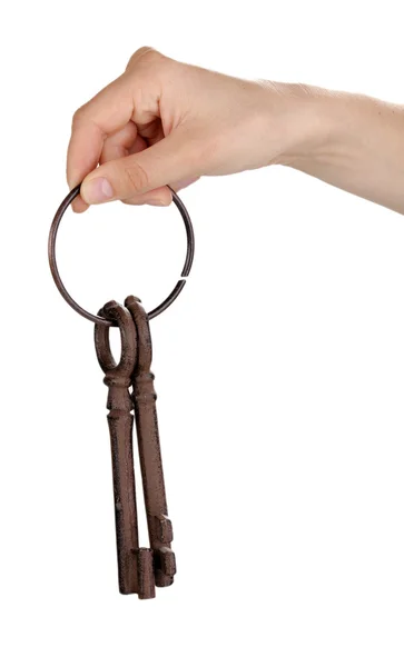 Mão da mulher segurando um monte de chaves antigas no fundo branco — Fotografia de Stock