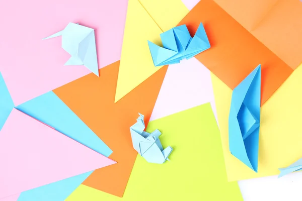 Origami azul sobre fondo de papel brillante —  Fotos de Stock