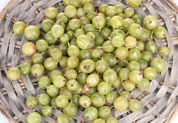 Green gooseberry on wicker mat close-up — Stock Photo, Image