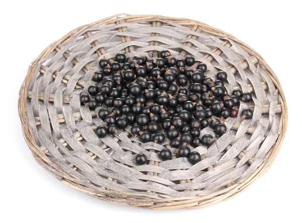 Black currant on wicker mat isolated on white — Stock Photo, Image
