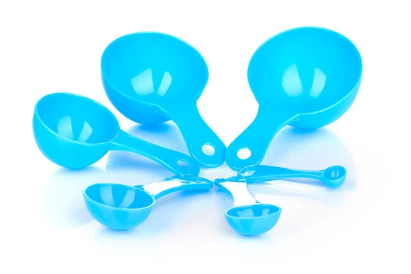 Blue measuring spoons isolated on white — Stock Photo, Image