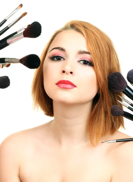 Portrait of beautiful woman with make-up brushes — Stock Photo, Image