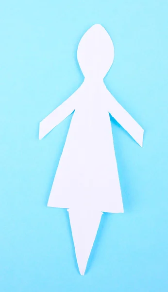 Paper woman on blue background — Stock Photo, Image