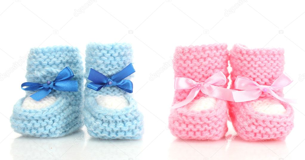 Pink and blue baby boots isolated on white