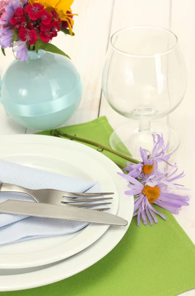 Beautiful holiday table setting with flowers — Stock Photo, Image