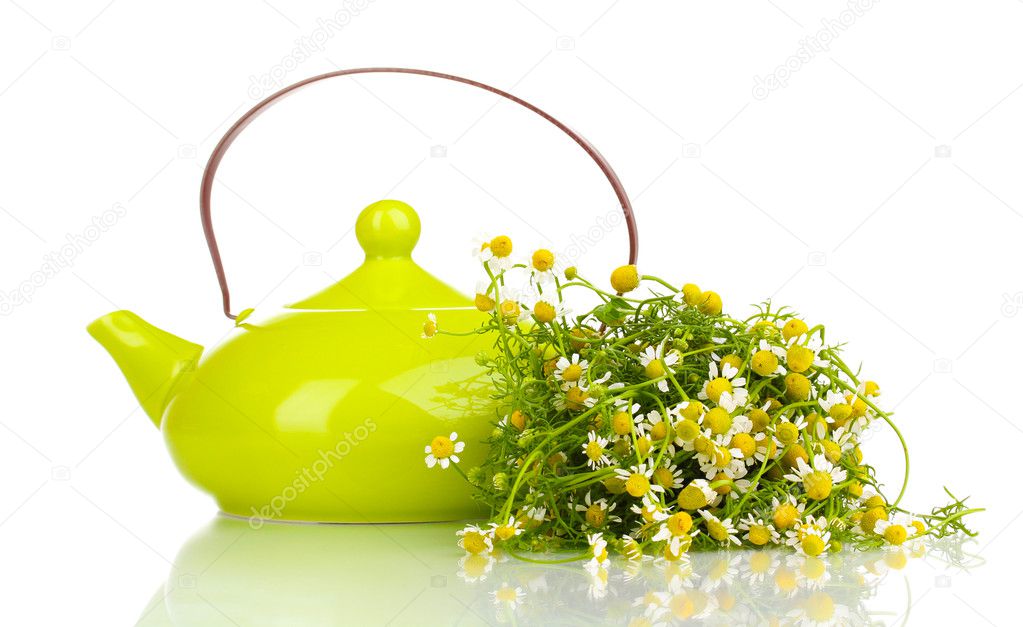 Teapot with chamomile tea isolated on white
