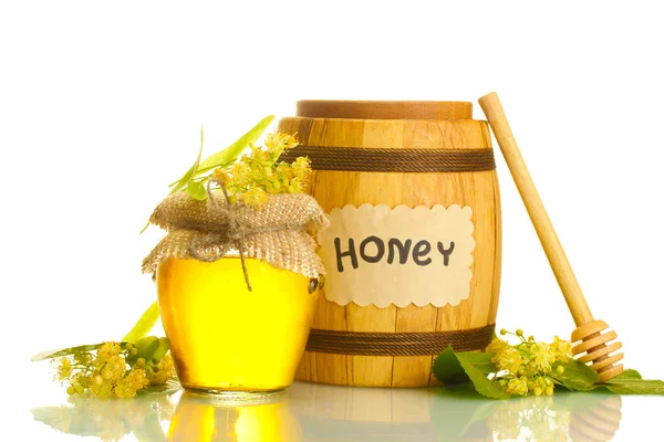 Vaso e botte con miele di tiglio e fiori isolati su bianco — Foto Stock
