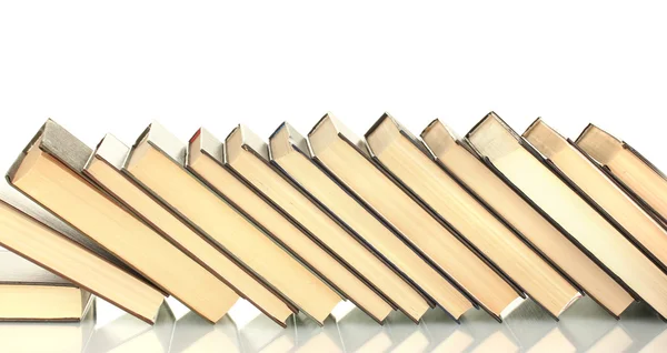 Pila inclinada de libros sobre fondo blanco — Foto de Stock