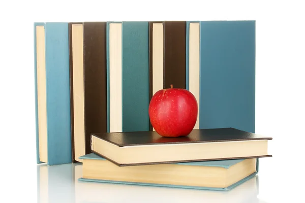 Blå og sorte bøger med æble isoleret på hvid - Stock-foto
