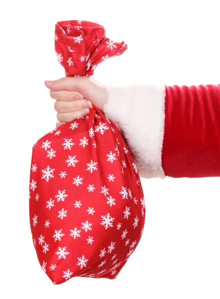 Santa claus ruka drží pytel dárků izolovaných na bílém — Stock fotografie
