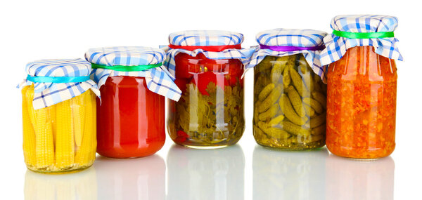 Jars with canned vegetables isolated on white
