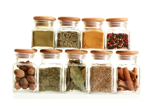 Powder spices in glass jars isolated on white — Stock Photo, Image
