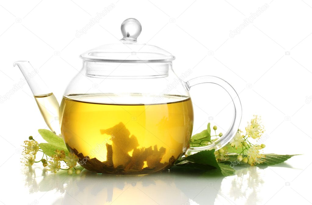 Teapot of linden tea and flowers isolated on white