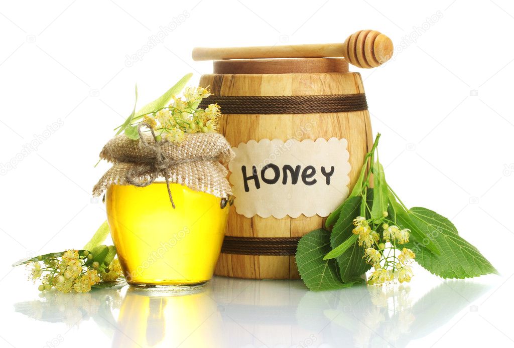 Jar and barrel with linden honey and flowers isolated on white