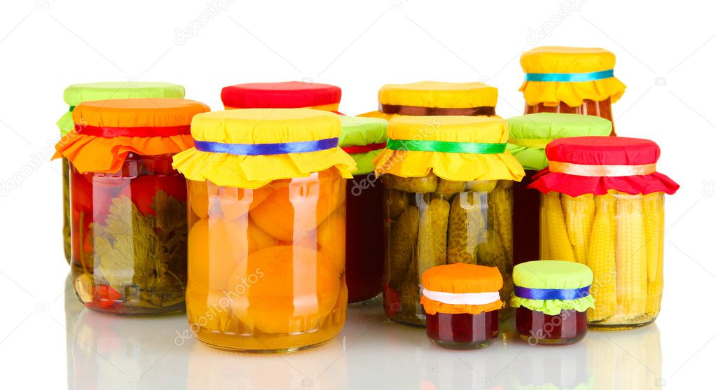 Jars with canned fruits and vegetables isolated on white