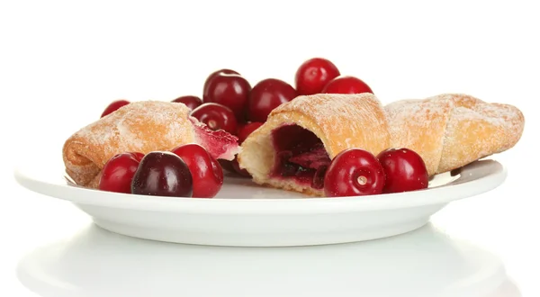 Vit platta med croissant och cherry isolerad på vit — Stockfoto