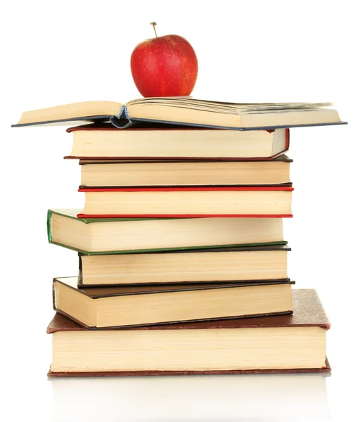 Torre di libri con mela isolata su bianco — Foto Stock