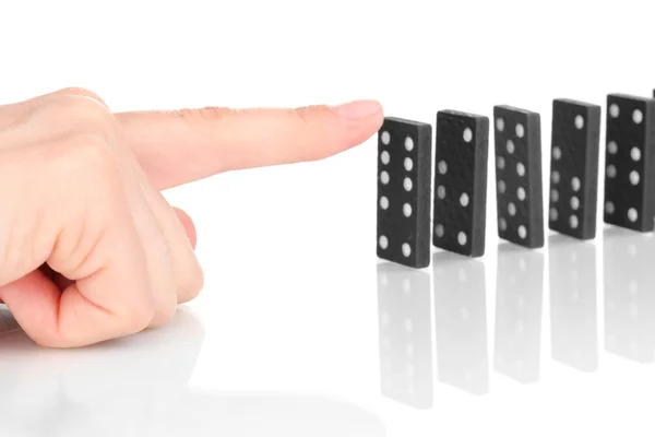 Tangan mendorong domino terisolasi pada putih — Stok Foto