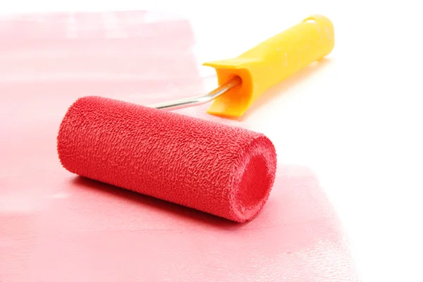 Paint roller with red paint isolated on white — Stock Photo, Image