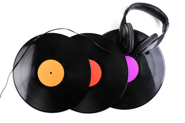 Black vinyl records and headphones isolated on white — Stock Photo, Image