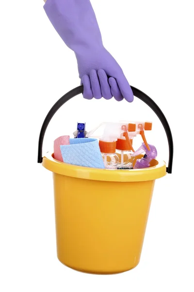 stock image Bucket with cleaning items in hand isolated on white