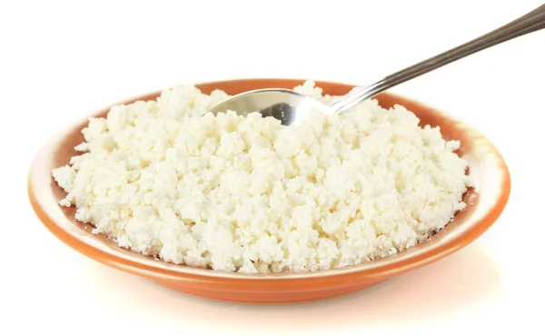 Spoon scoops of cottage cheese in a plate on white background — Stock Photo, Image