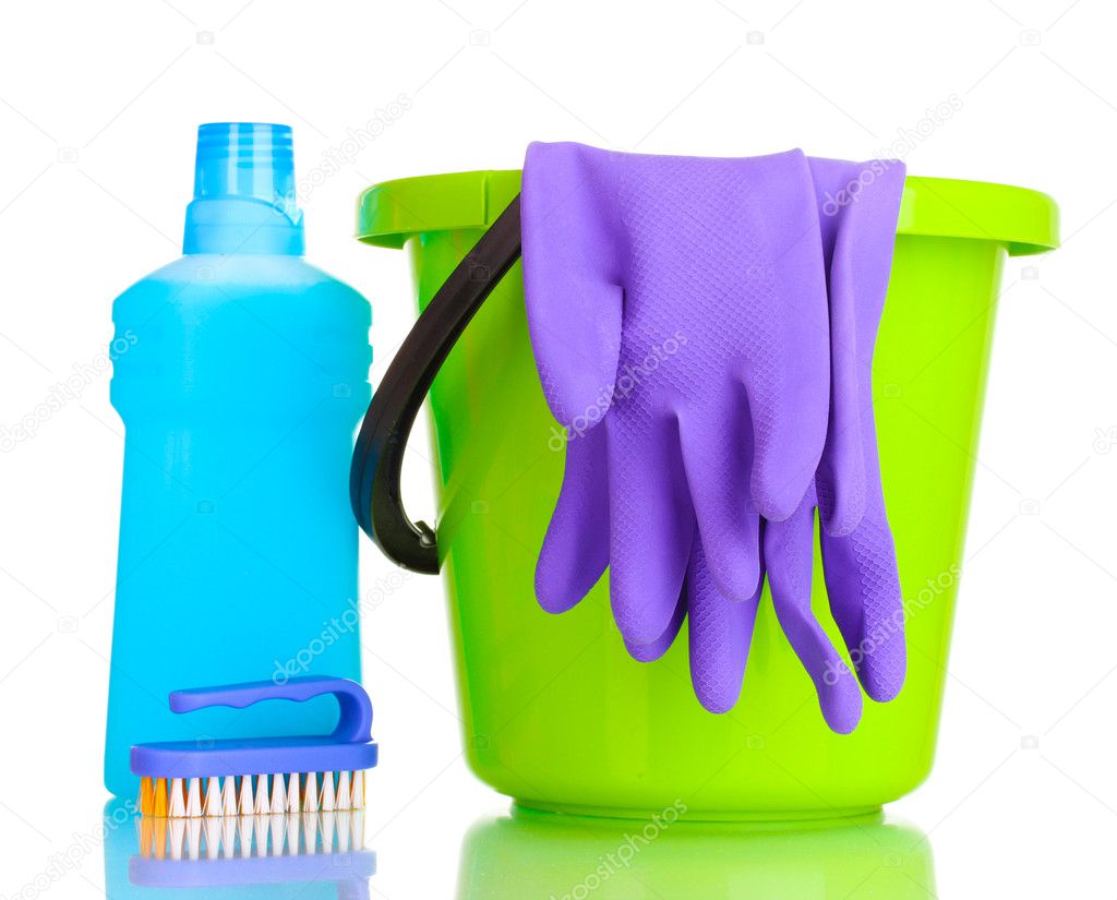 Detergent and bucket with gloves isolated on white