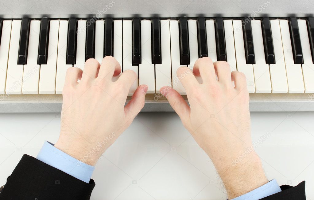 Hands of man playing piano