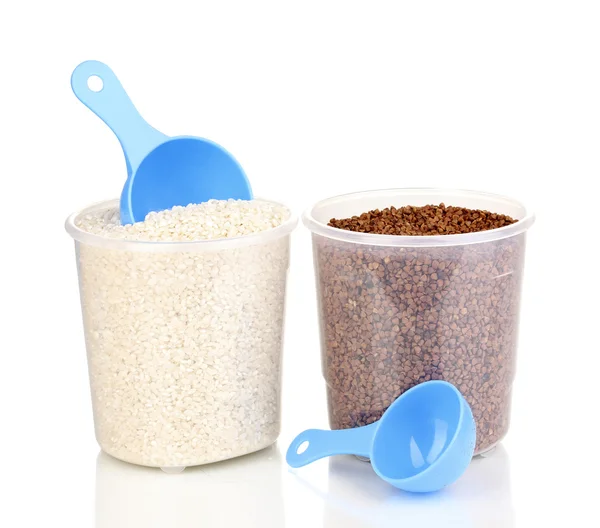 Measuring spoons and plastic containers with grain isolated on white — Stock Photo, Image