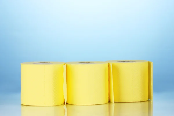 Rolls of toilet paper on blue background — Stock Photo, Image