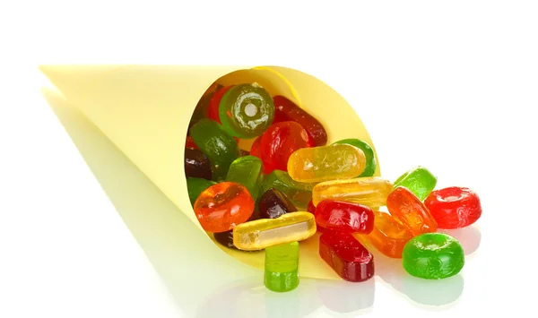 Doces coloridos saborosos em saco brilhante isolado em branco — Fotografia de Stock