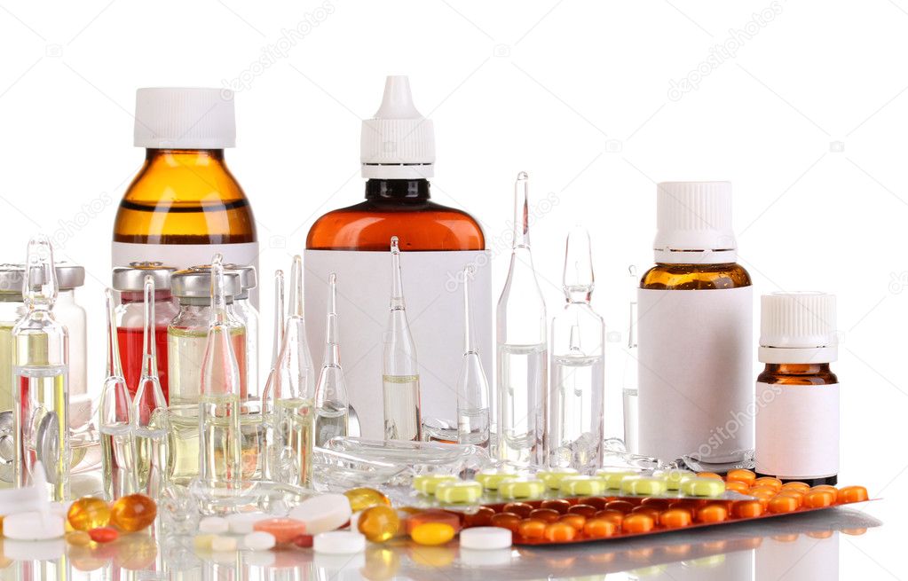 Medical bottles with medical ampoules and tablets isolated on white